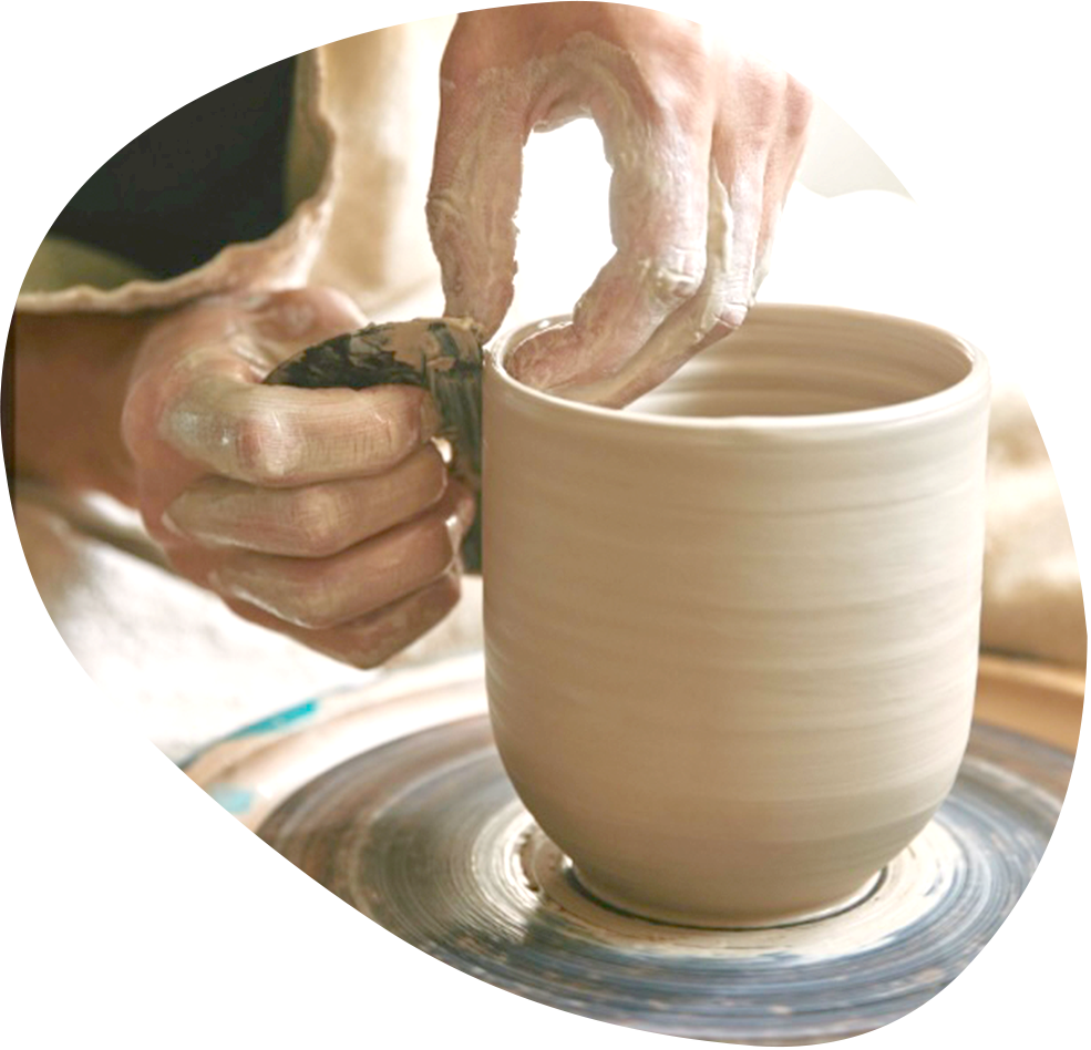 hands making a ceramic pot